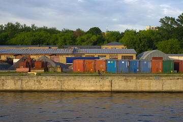 cargo containers on the riverbank at the port