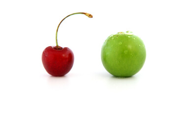 Single whole fresh green Can Erik plum and cherry close up isolated on white background. green plums and cherry pictures from the first fruits in summer