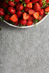 Ripe delicious strawberries on a white plate