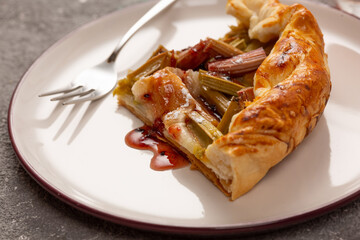 Delicious rhubarb tart on gray background
