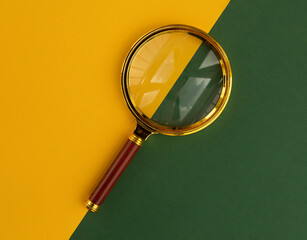 Magnifier over yellow and green background. Search tool.