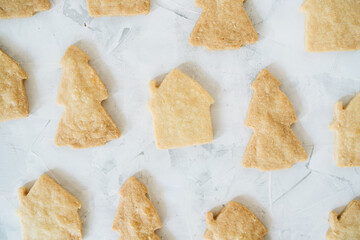 Flat lay of gingerbread with shape of christmas tree and houses