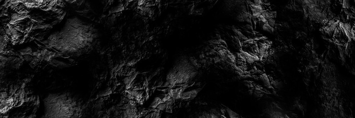 Black stone background. Black and white grunge background. Old black stone wall. Grunge banner....