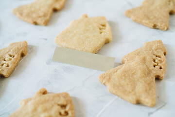 Flat lay of gingerbread with shape of christmas tree and houses