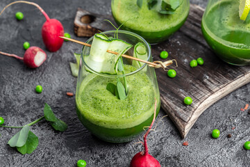 Healthy green smoothie with Organic Greens, peas, cucumber, radish, spinach and lime. Healthy Detox...