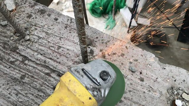 slow motion cutting steel line with electric saw on construction site