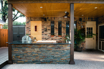 New and modern outdoor kitchen on a sunny summer evening - 439645000