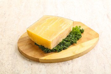 Parmesan cheese piece over board