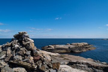 the beautiful coast of norway with its rock formations and blue water on a beautiful summer day