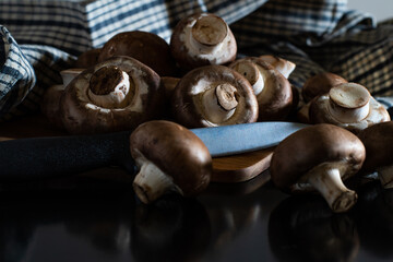 Fresh pile of organic mushrooms isolated from background with clipping knive and full depth of field