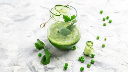 Healthy smoothie with green leaves of kale green fresh peas, cucumber, spinach and lime. Healthy Detox Drink