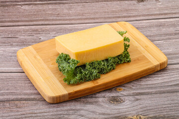 Tasty yelloow Tilsiter cheese brick