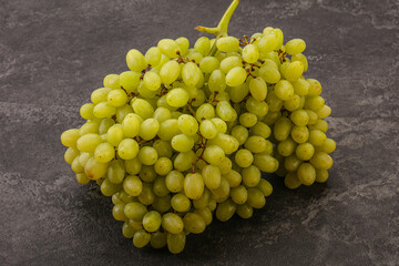 Green grape branch over background