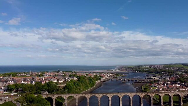 4k drone footage of the Royal Border Bridge spanning the River Tweed in Berwick, Northumberland, UK