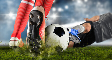 Soccer player making sliding tackle