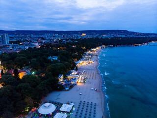 View from above of the hotels in night Varna in Bulgaria. Summer holiday in Europe. Aerial photography, drone view. - obrazy, fototapety, plakaty