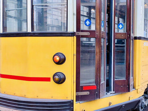 Means of urban transportation: trams in Milano (Italy) are of the old kind and brightly painted.