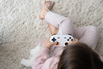 Little girl playing video game
