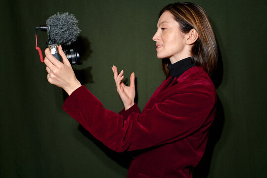 a woman records herself on video