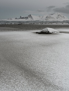 Texture of snow on sand.  Lofoten. Norway