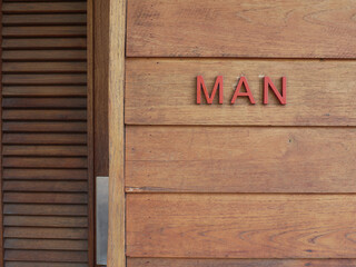 Red letter of MAN on the wooden wall