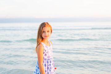 Fototapeta na wymiar Little Girl on Beach at Dusk