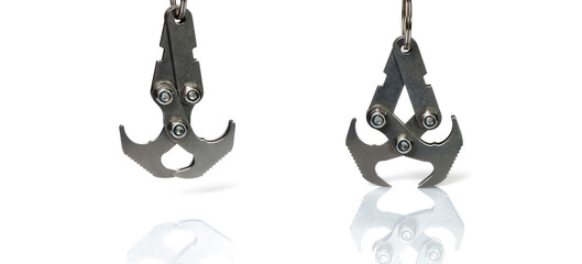 Closed and opened metal hooks close-up isolated on white background