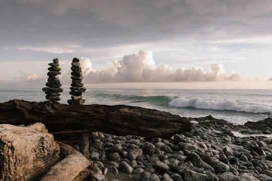 Waves Crashing on beach with Cairn of Stones 