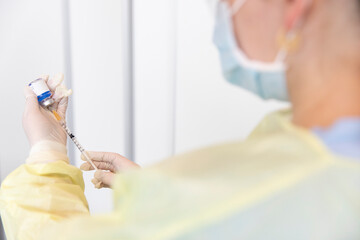 A nurse administering the Coronavirus vaccine