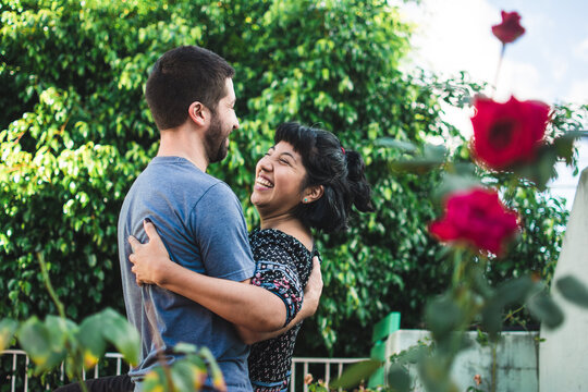 Sweet young couple dancing in their back yard