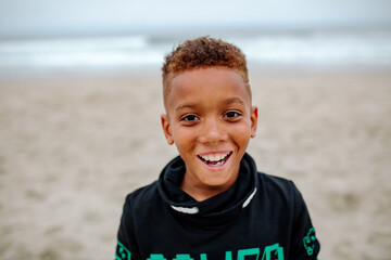 Smiling African American boy at beach