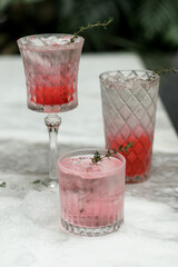 three glasses of Jamaica flower water under the sun in the nature