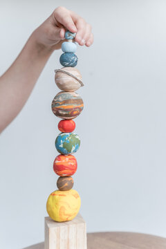 space planet stacking toy with hand 