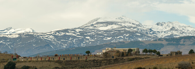 buildings in front of the Sierra Nevada mountains