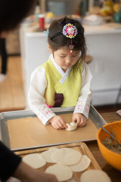 Little girl making mandoo