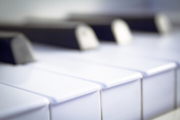 Part of the keyboard of a piano in white color