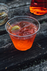 Glamping with a aperol spritz aperitif cocktail happy hour outdoors