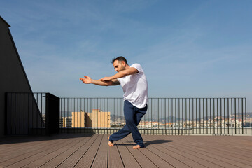 man dancing on rooftop