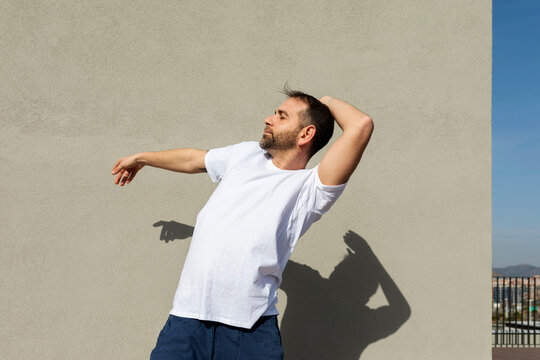 man dancing on rooftop