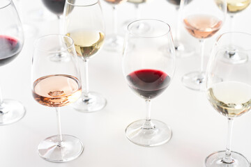 Glasses of various wine on table