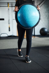 Fototapeta premium Sporty female using bosu ball in gym