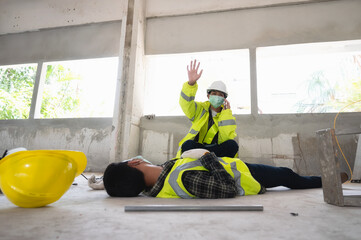 An accident of a man worker at the construction site and call to the safety officer for rescue and...