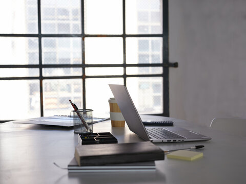 Modern workspace with laptop and coffee cup