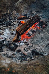 Smoldering campfire ashes 