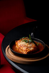 Side view ground beef lasagna with tomato sauce