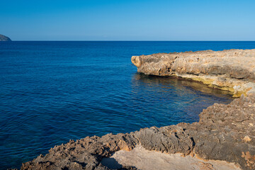 Fototapeta na wymiar The coast of the Punta de n’Amer peninsula on Mallorca island in Spain