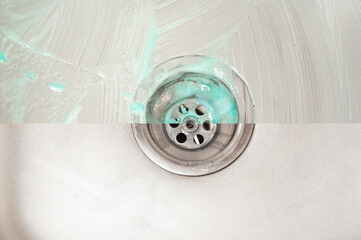 An illustrative example of the action of a high-quality detergent using the example of a kitchen sink drain