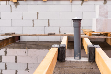 Wooden beams for a partition between the first and second floors and an exhaust from the basement...