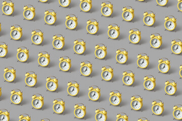 Pattern of yellow vintage alarm clocks