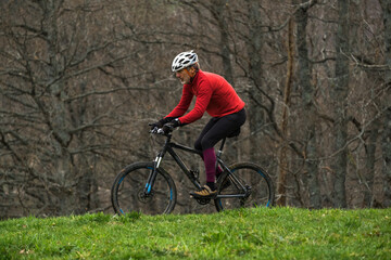 man cycling off road on mountain-bike